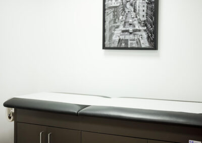 physiotherapy-bed-with-portrait-art-wall-integrated-internal-medicine-clinic-queens-ny