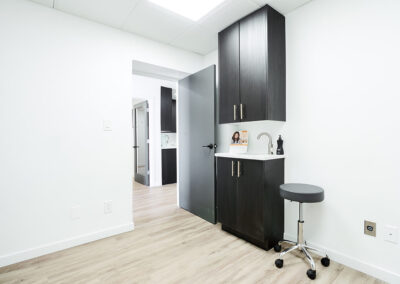 simple-black-oak-wood-cabinet-with-sink-integrated-internal-medicine-clinic-queens-ny