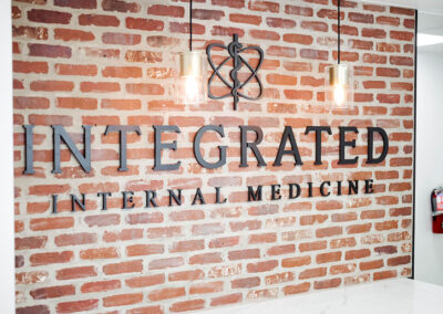 sophisticated-integrated-internal-medicine-business-name-logo-brick-wall-with-modern-lightings