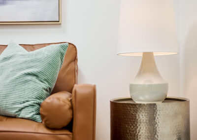 white-lampshade-beside-brown-sofa-chair-integrated-internal-medicine-queens-ny